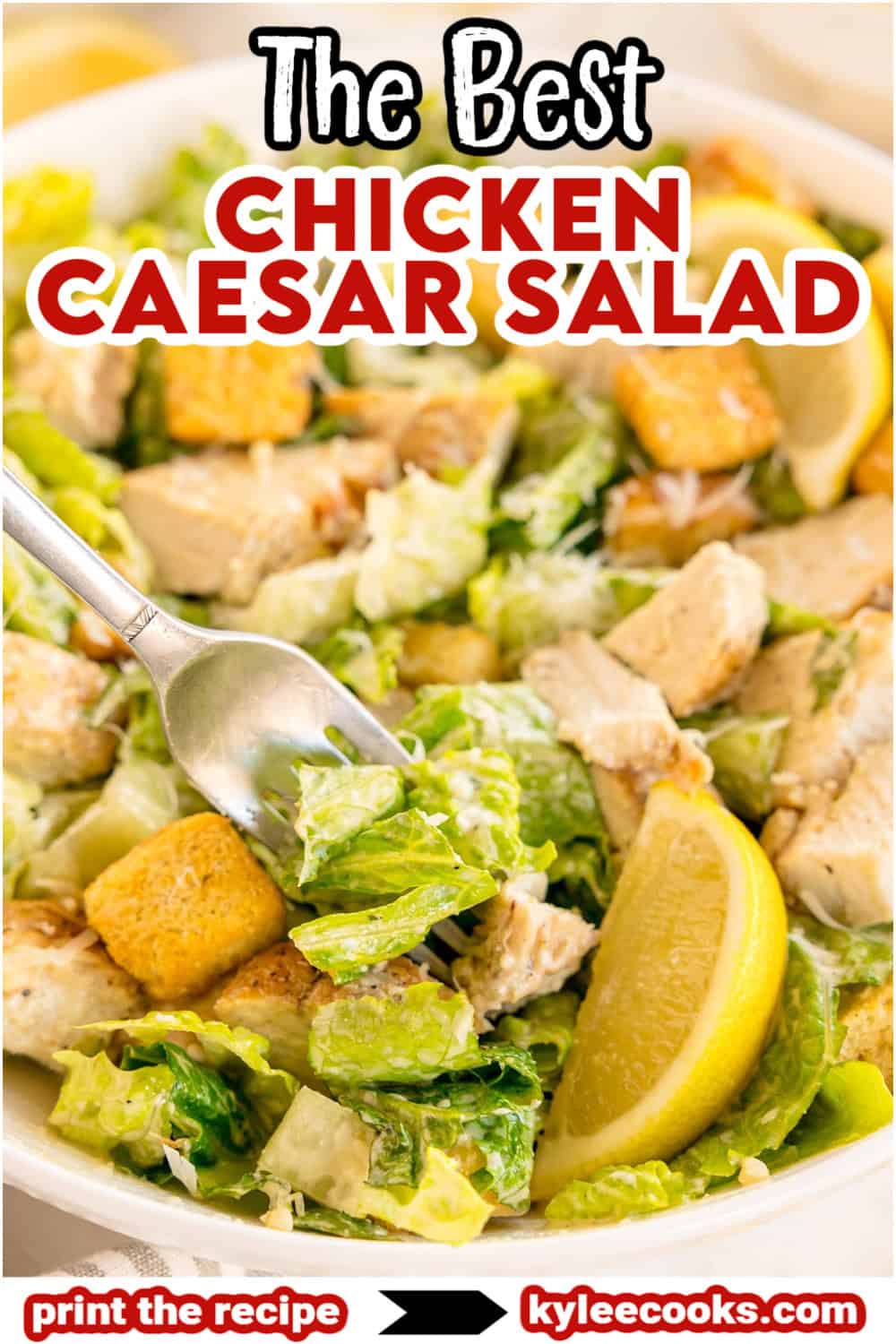 A forkful of chicken Caesar salad with croutons and lemon. Text on the image says 'The Best Chicken Caesar Salad'.