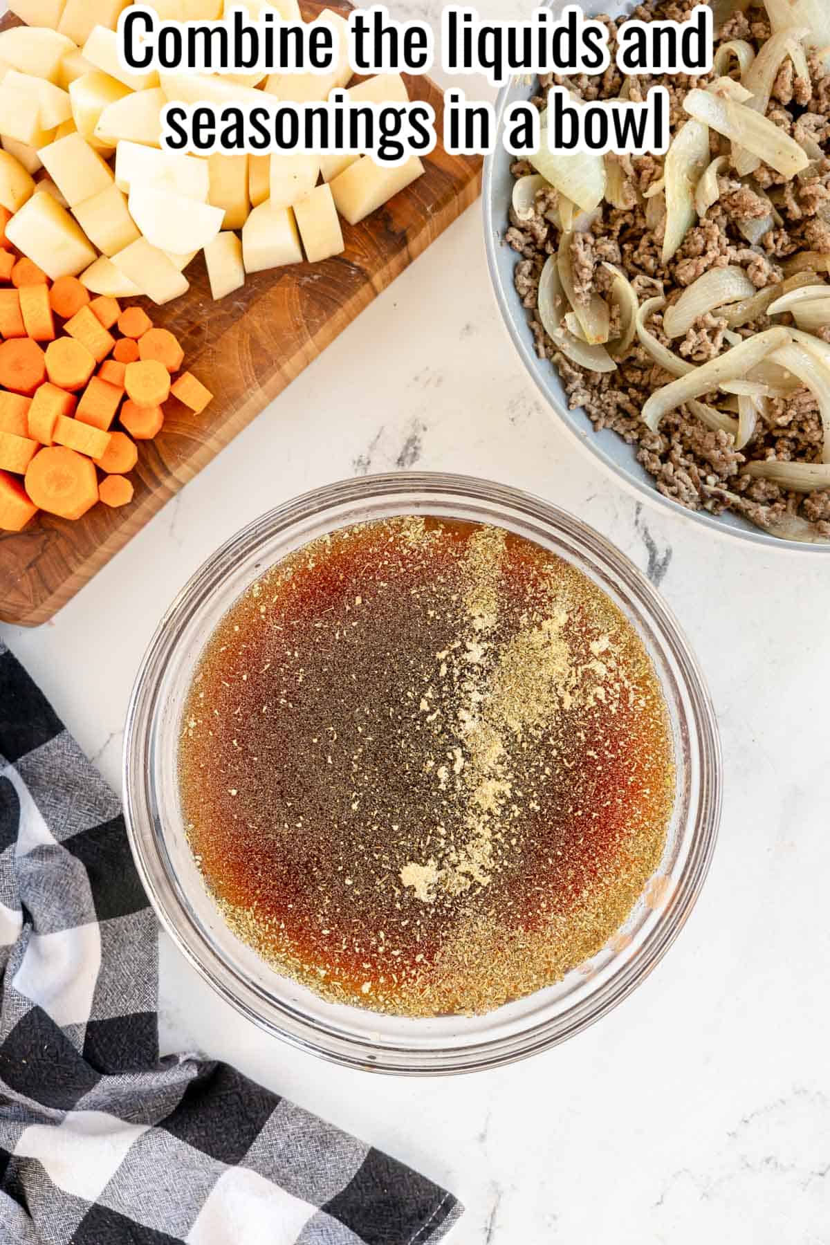 a bowl of liquid and seasonings for poor man's stew.
