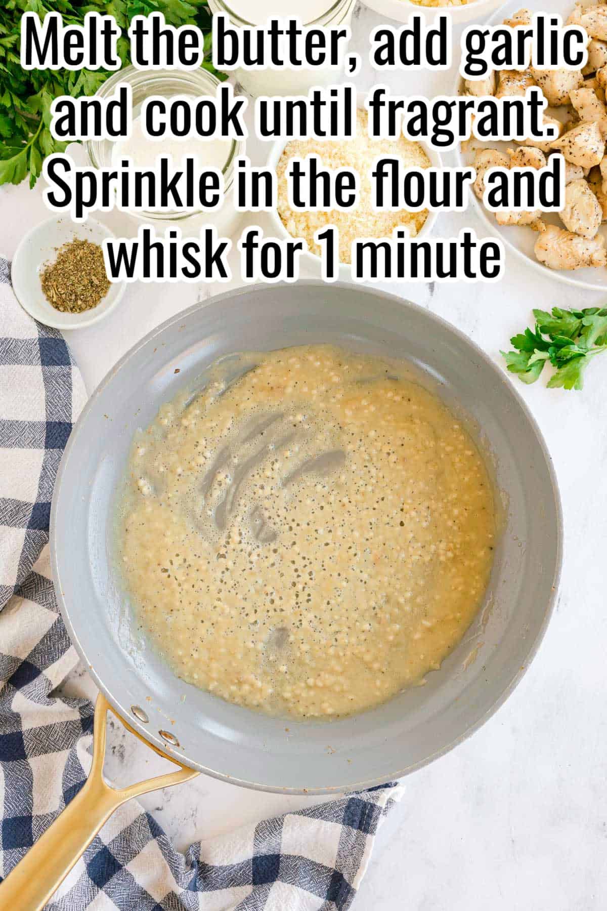 A skillet with garlic and flour mixture being cooked in melted butter. Text on the image says 'Melt the butter, add garlic and cook until fragrant. Sprinkle in the flour and whisk for 1 minute'.