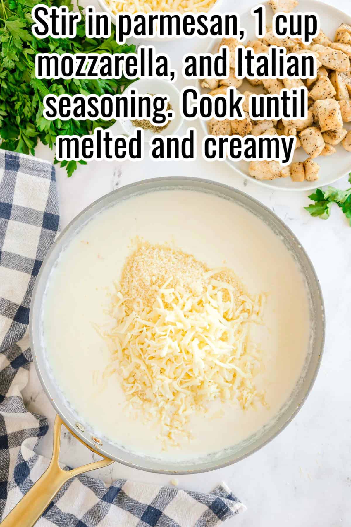 Parmesan and shredded mozzarella added to the skillet of white sauce. Text on the image says 'Stir in parmesan, 1 cup mozzarella, and Italian seasoning. Cook until melted and creamy'.