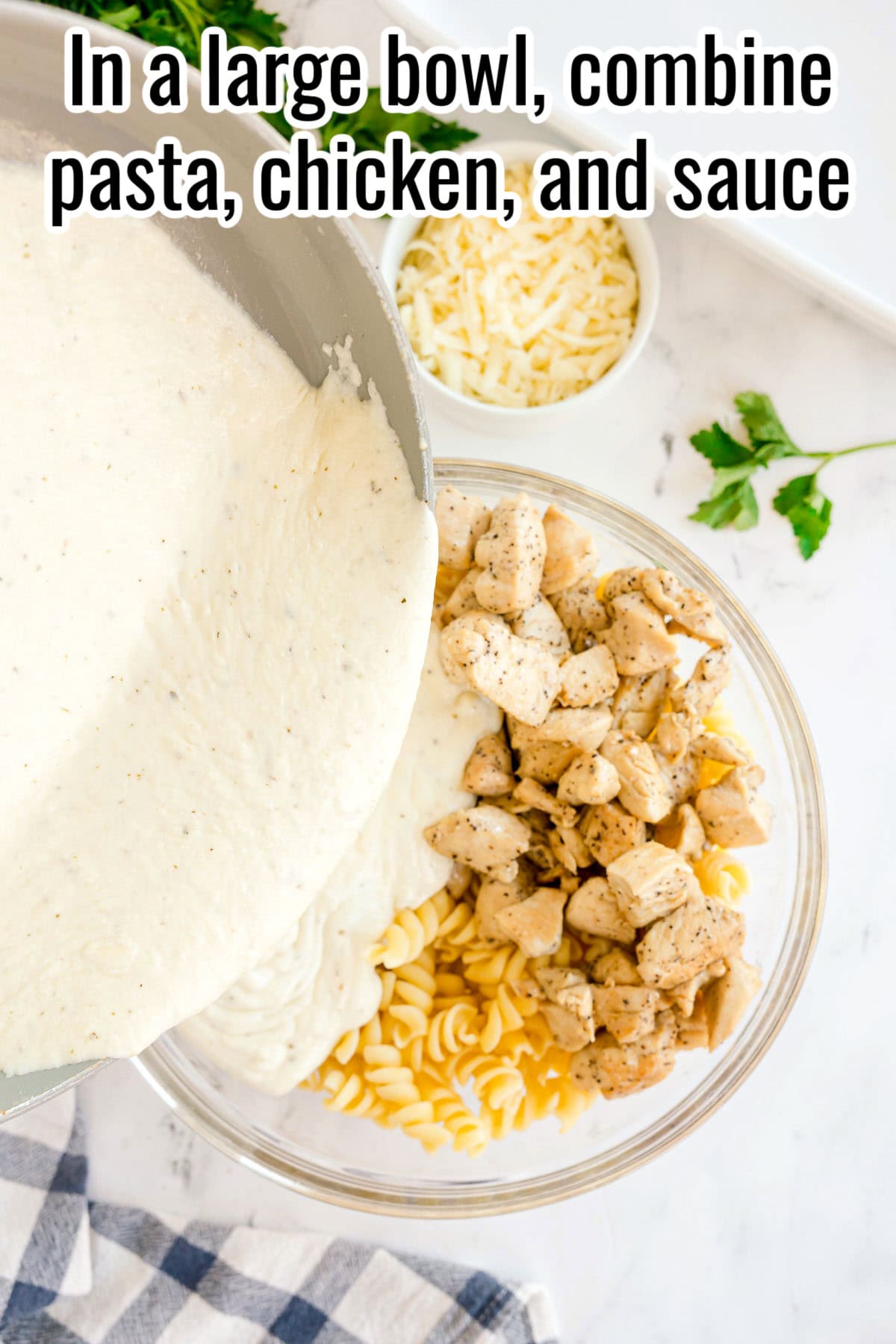 Sauce being poured into a bowl with cooked pasta and chicken. Text on the image says 'In a large bowl, combine pasta, chicken, and sauce'.