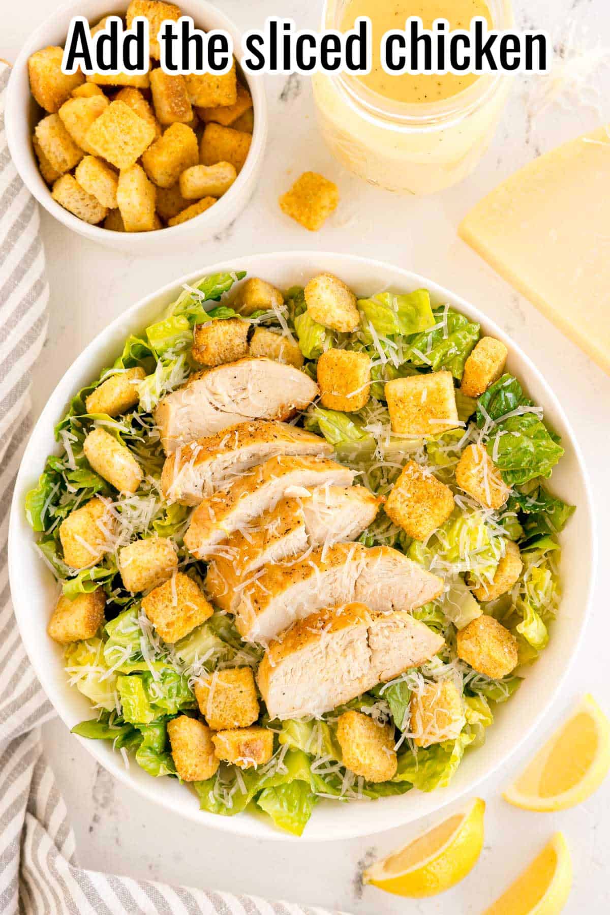Sliced cooked chicken added to Caesar salad in a bowl. Text on the image says 'Add the sliced chicken'.