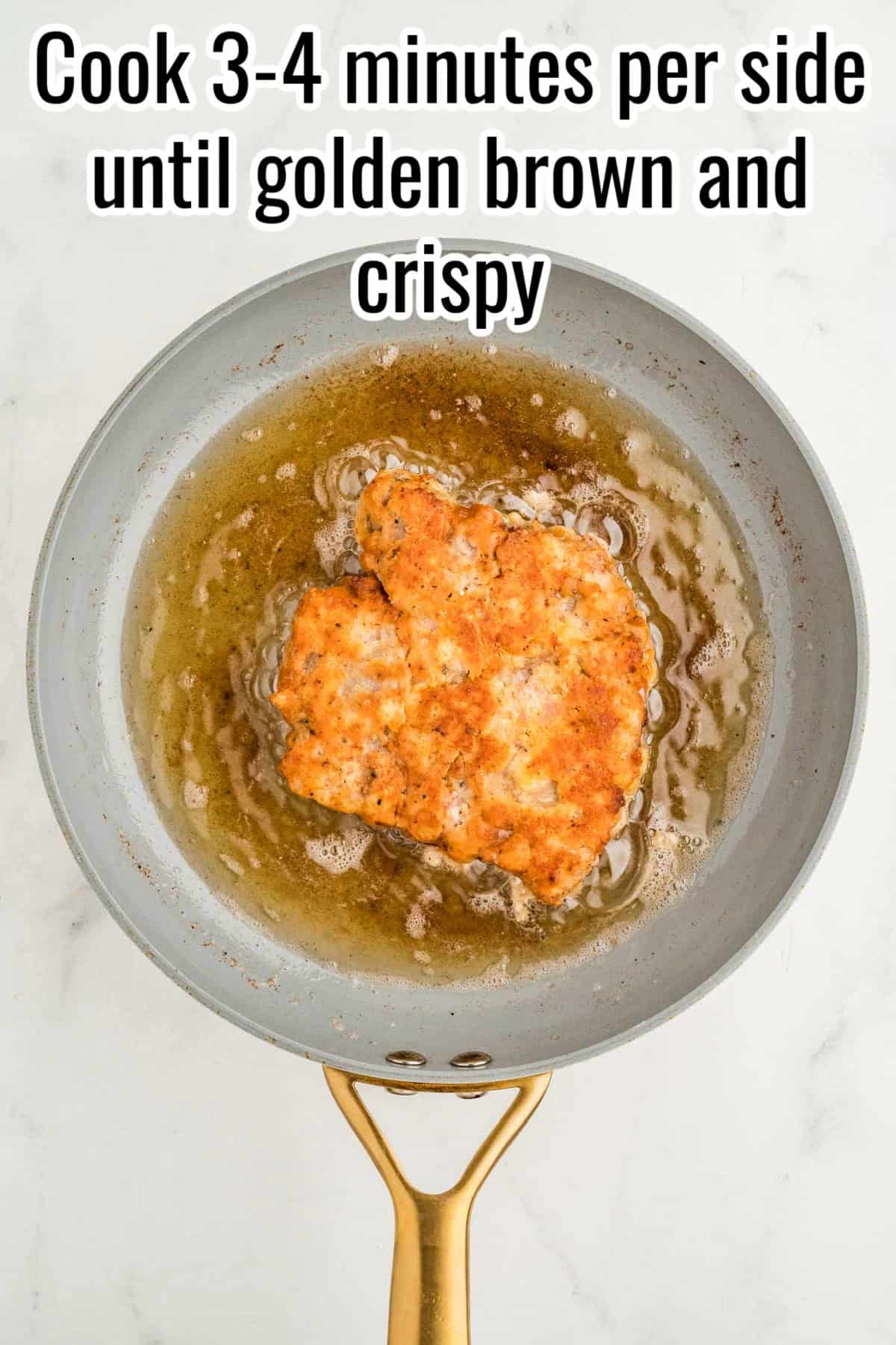 Golden brown breaded steak frying in a skillet. Text on the image says 'Cook 3-4 minutes per side until golden brown and crispy'.