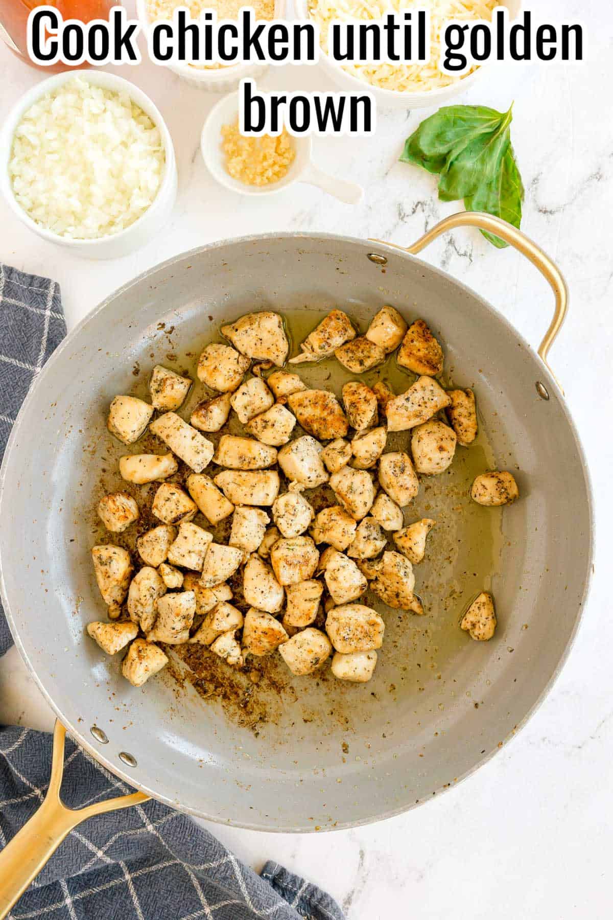 A skillet with browned chicken pieces. Text on the image says 'Cook chicken until golden brown'.