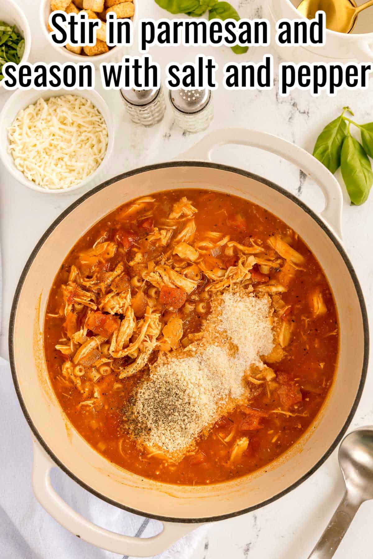 Parmesan, salt, and pepper added to the soup. Text on the image says 'Stir in parmesan and season with salt and pepper'.