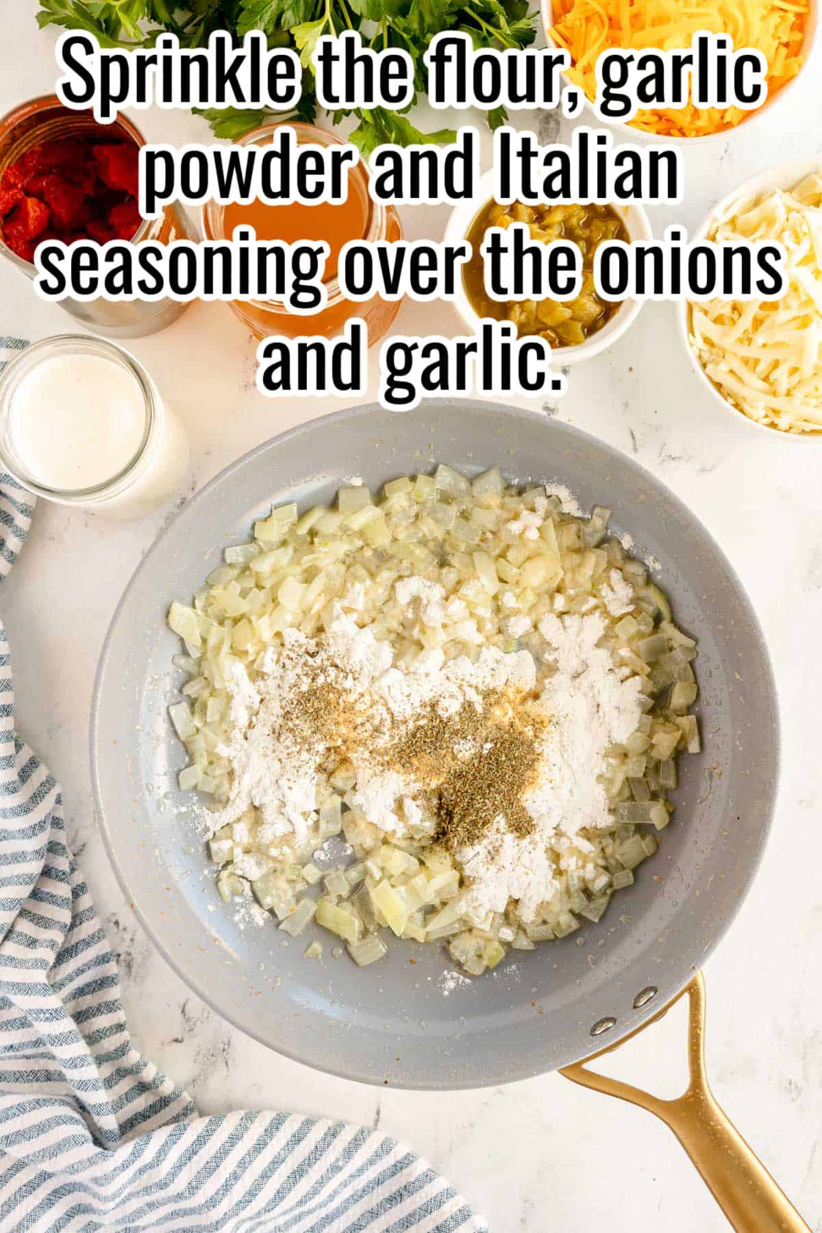 A frying pan with onions and garlic in it.