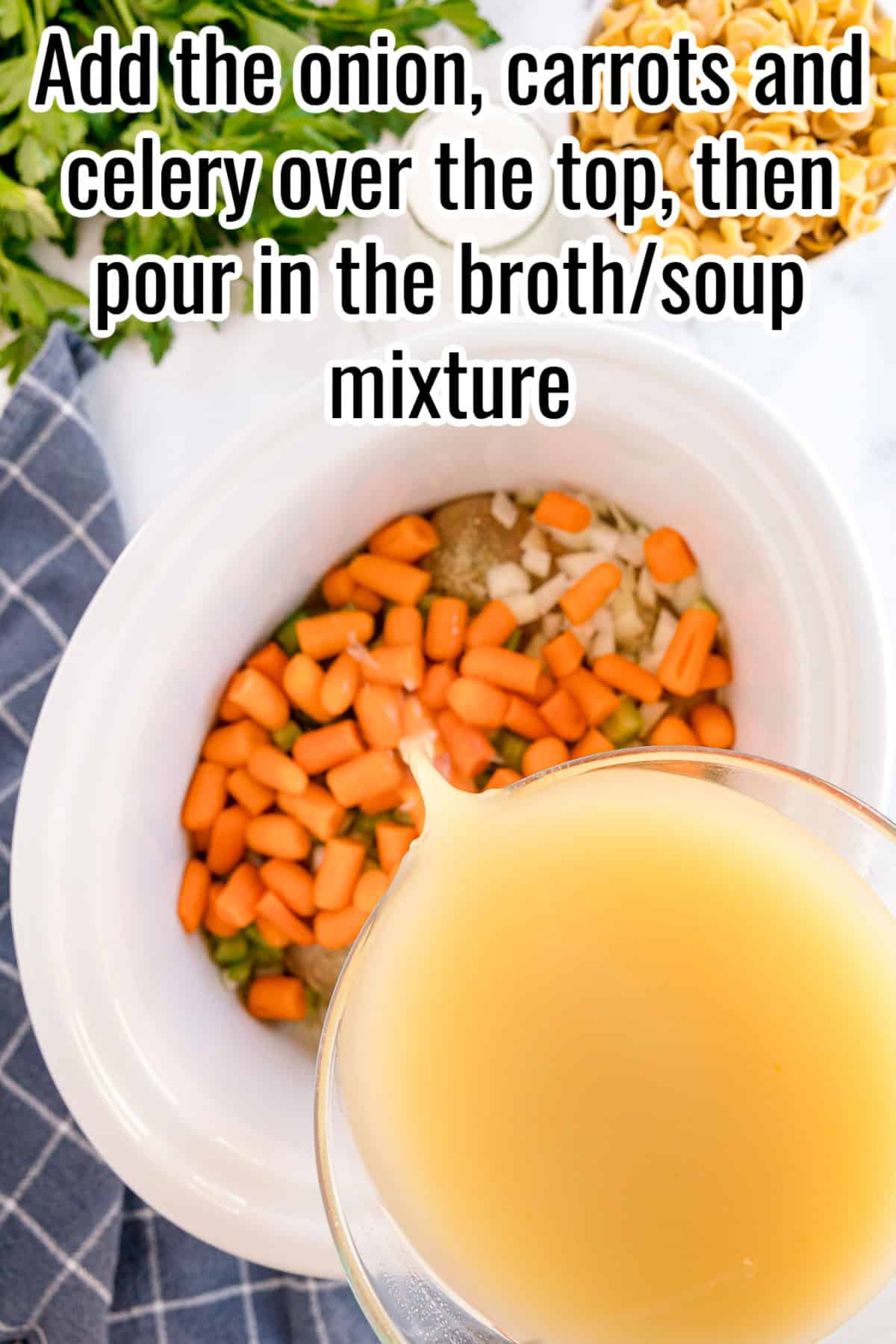 Onion, carrots, and celery added to the slow cooker over chicken, with broth being poured in. Text on the image says 'Add the onion, carrots and celery over the top, then pour in the broth/soup mixture'.