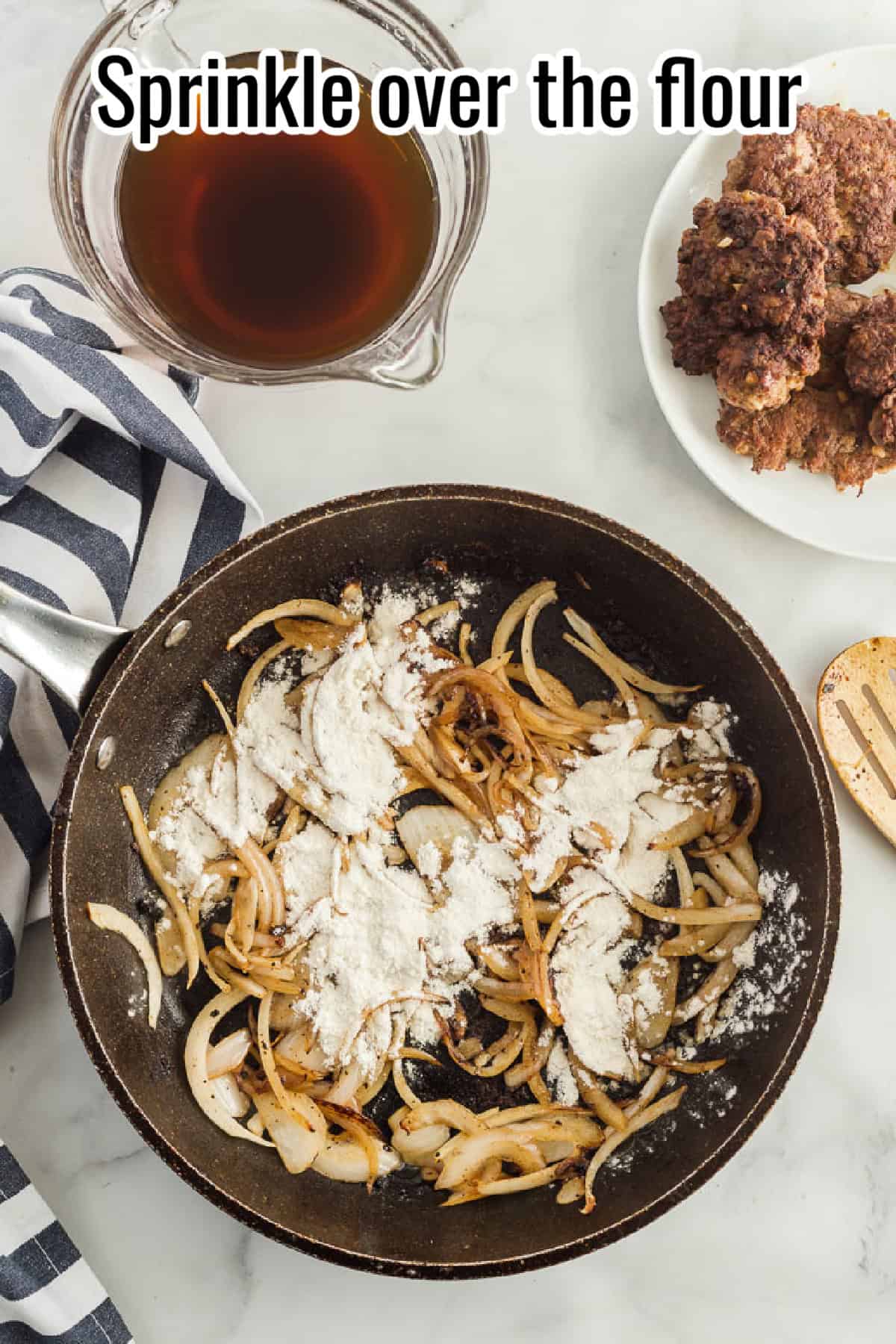 Caramelized onions in a skillet with flour sprinkled over them, with text overlay reading "Sprinkle over the flour."