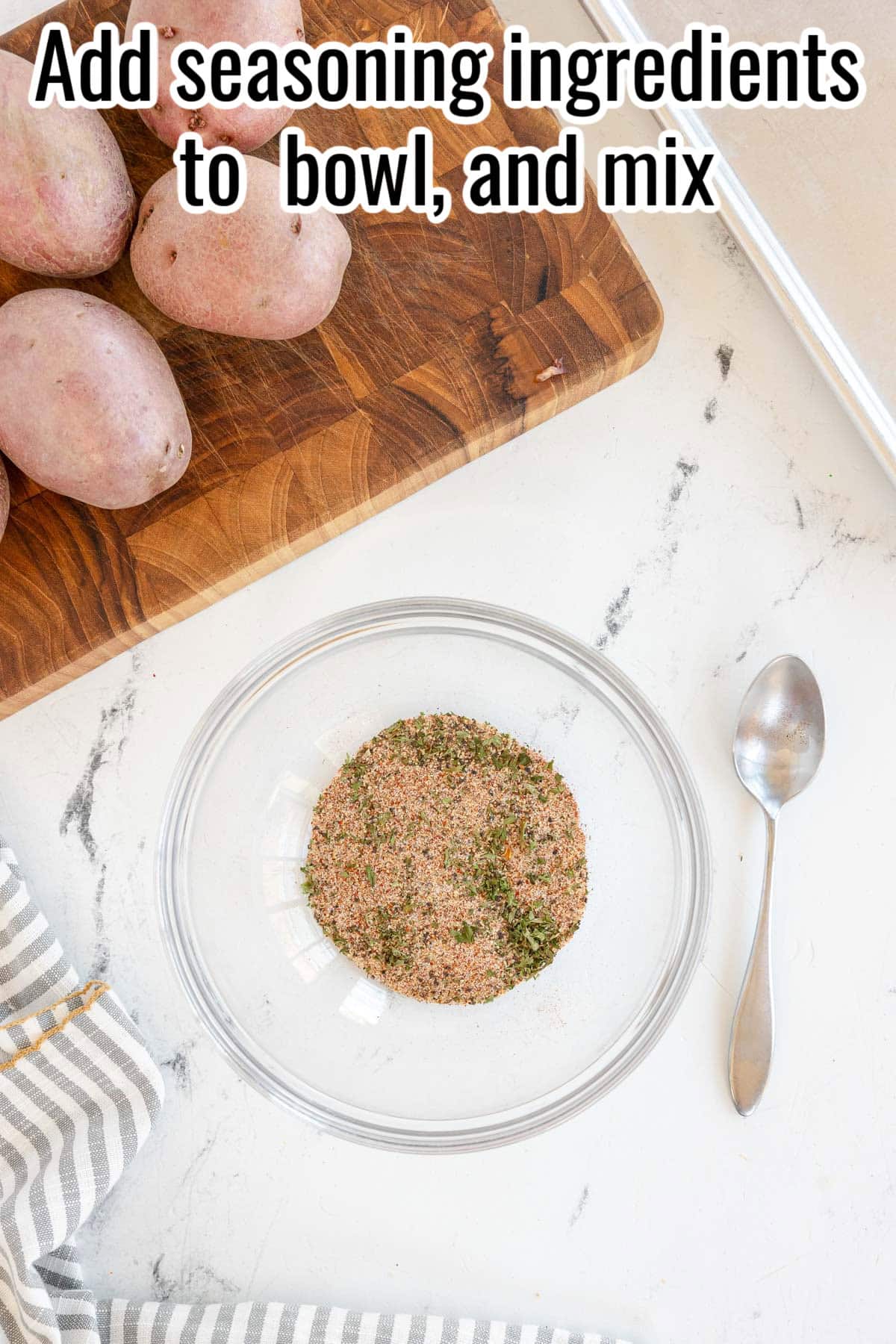 A bowl with mixed dry seasoning. Whole red potatoes on a wooden board. Text on the image says 'Add seasoning ingredients to bowl, and mix'