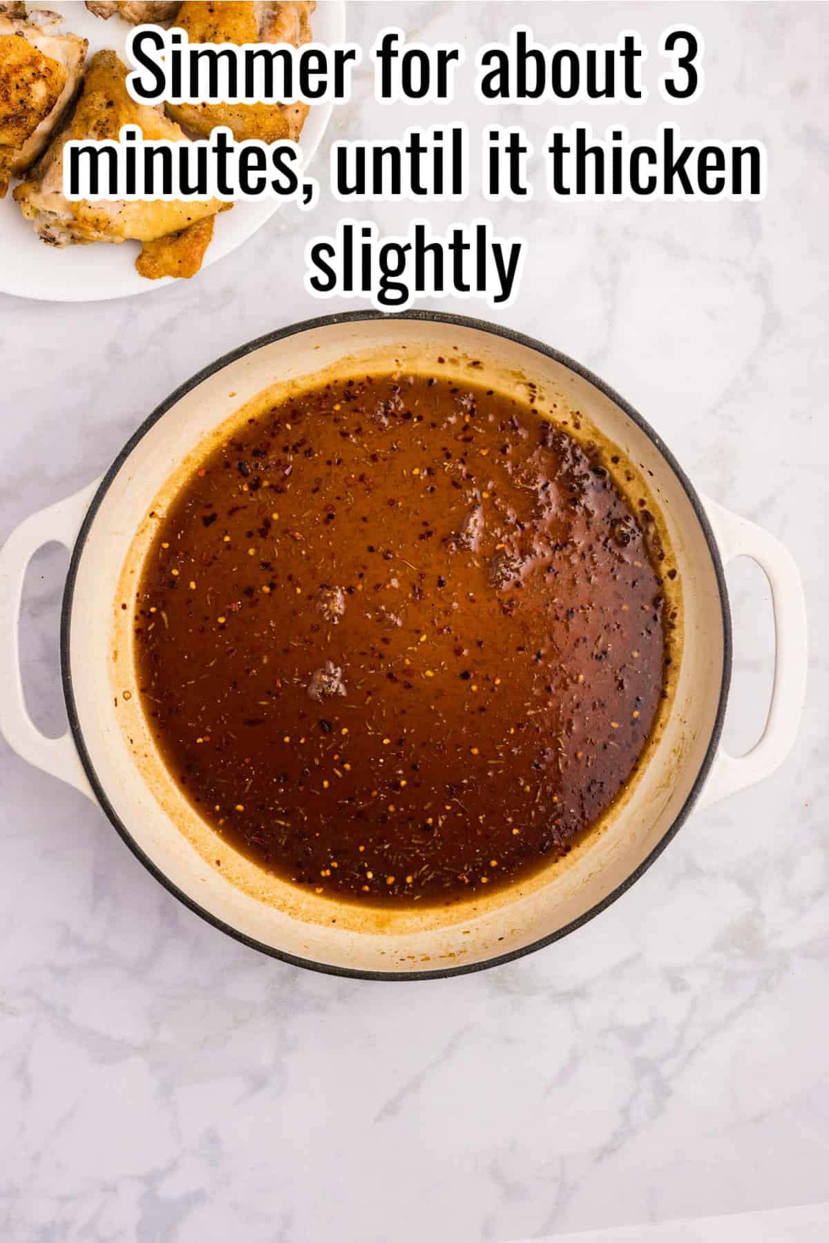 Glaze simmering and thickening slightly in a skillet. Text on the image says 'Simmer for about 3 minutes, until it thicken slightly'.