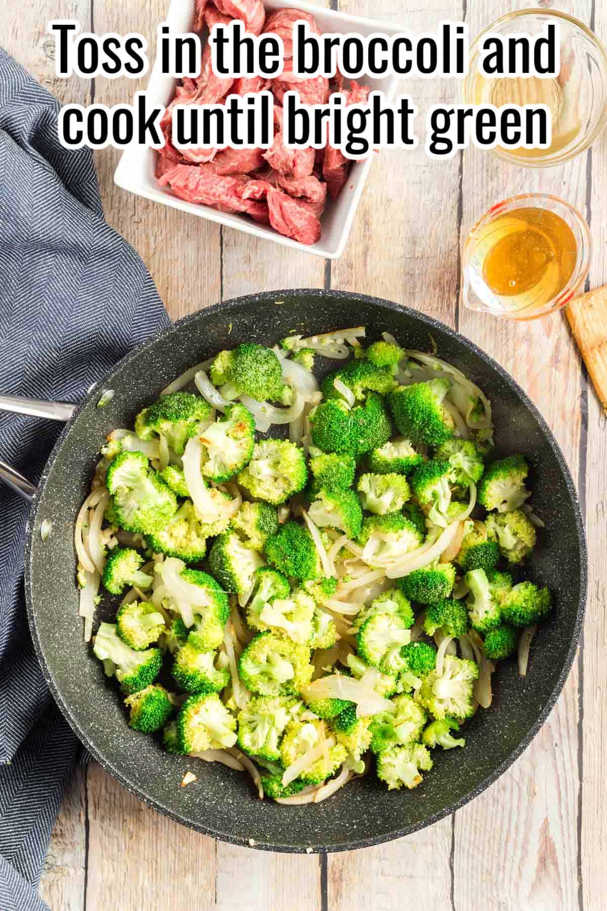A skillet with onions and broccoli cooking together until bright green. Text on the image says 'Toss in the broccoli and cook until bright green'.