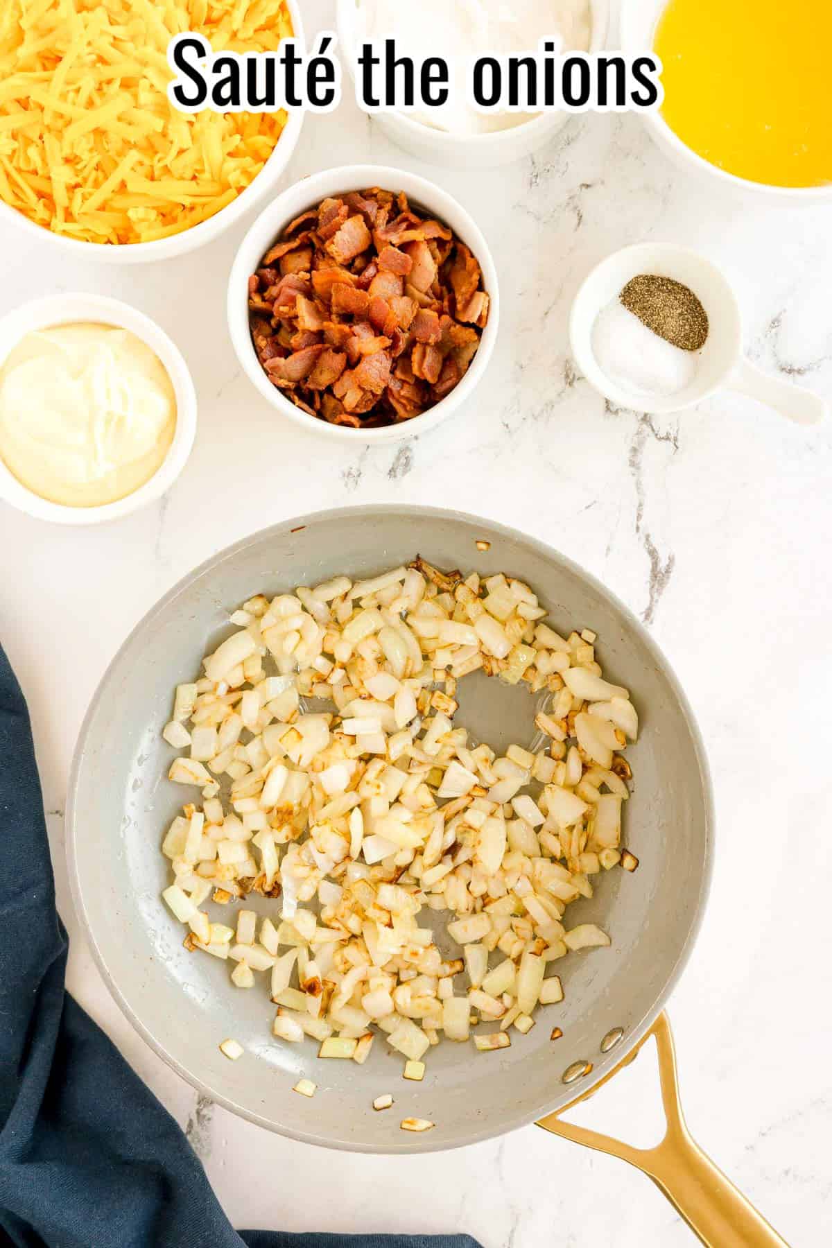 Chopped onions sautéing in a pan, with bowls of cheese, bacon, and seasonings nearby. Text on the image says 'Sauté the onions'.
