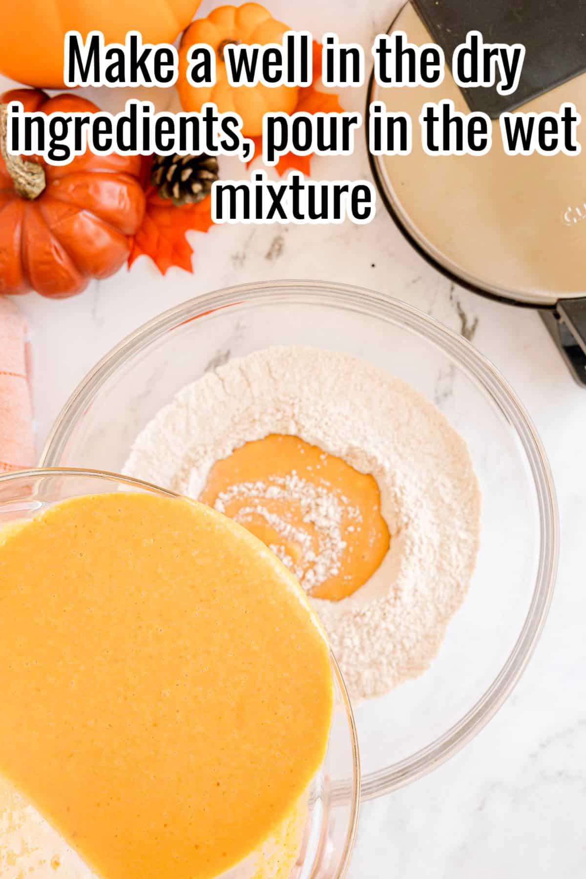 A bowl of dry ingredients with a well in the center and wet mixture being poured in. Text on the image says 'Make a well in the dry ingredients, pour in the wet mixture'.