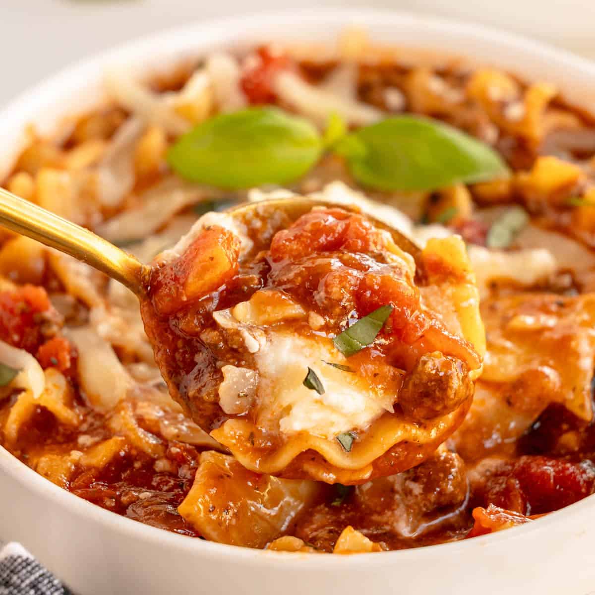 crockpot lasagna soup on a spoon.